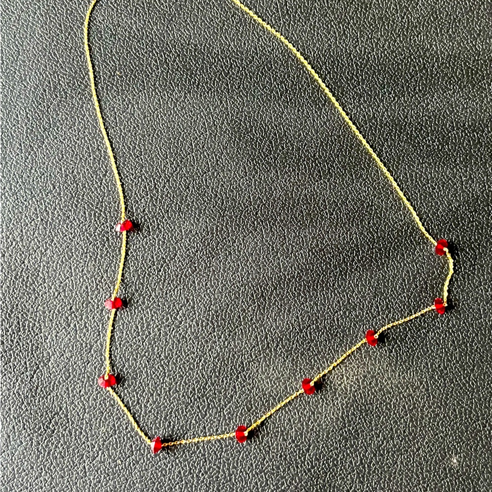 Gold necklace with red beading